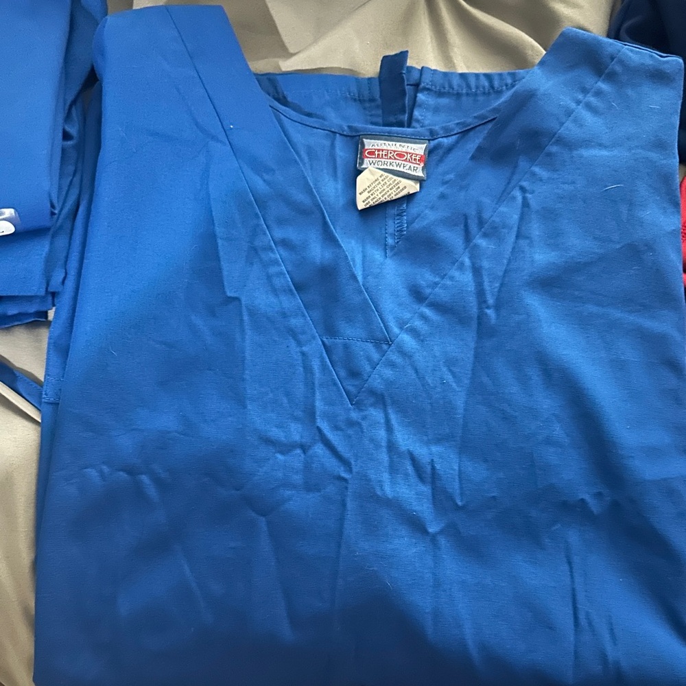 Lot of royal blue scrubs